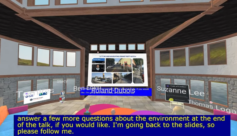 Version 2 of A11yVR in a rustic setting with rock-style walls and wood panels. Top level windows show greenery while lower level windows show water. Brightly-colored sofa and rugs add a pop of color.
