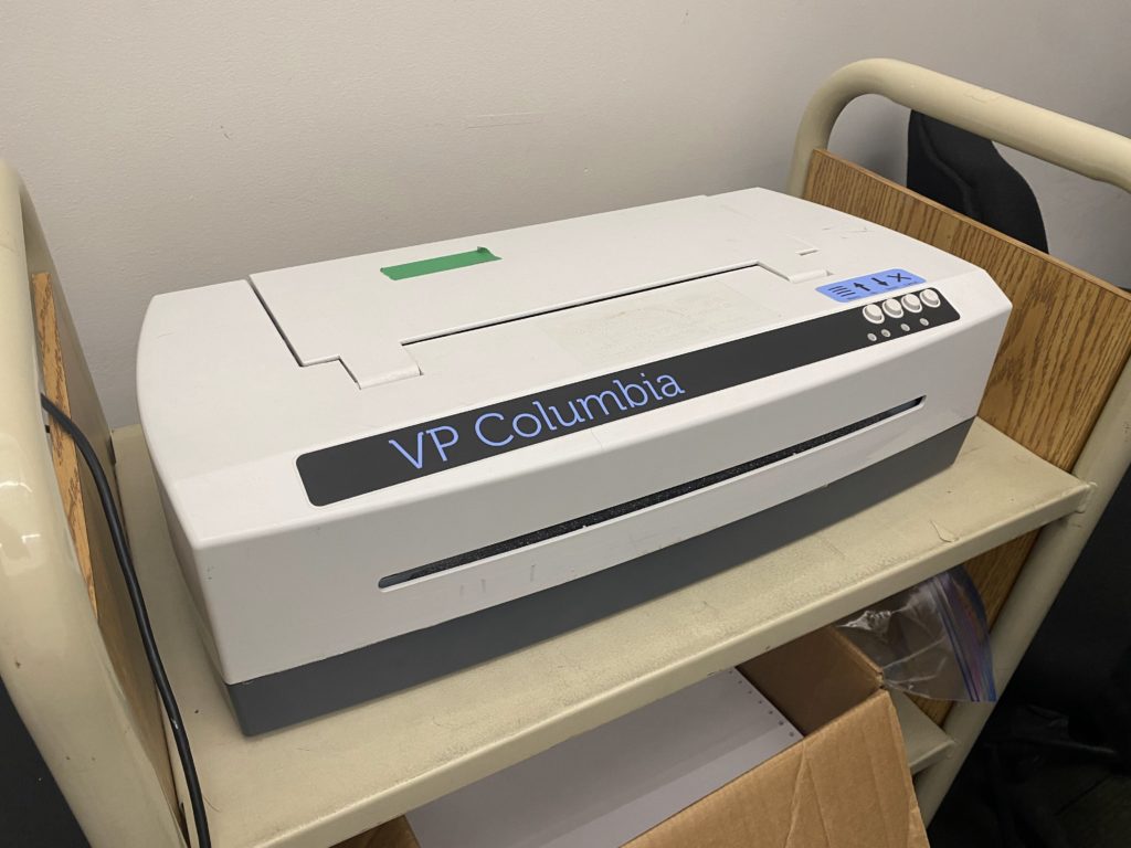 ViewPlus Columbia embosser that's like a printer with four buttons and a slot for the paper