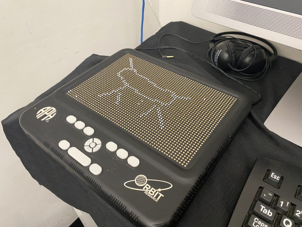 Graphiti tablet with something that looks like a hot dog with legs, a tail, and a horn